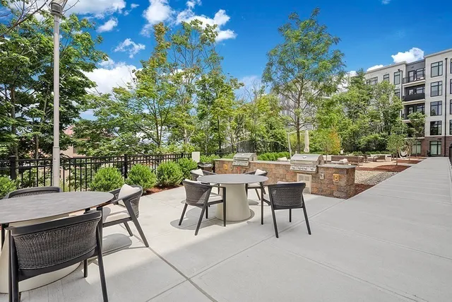 a view of swimming pool with outdoor seating