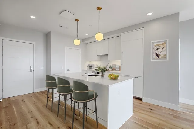 a kitchen that has a table and chairs in it