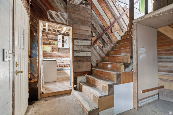 25615 Main Street Portage, UT 84331 - Photo 30 of 42 Staircase featuring wooden walls and concrete flooring