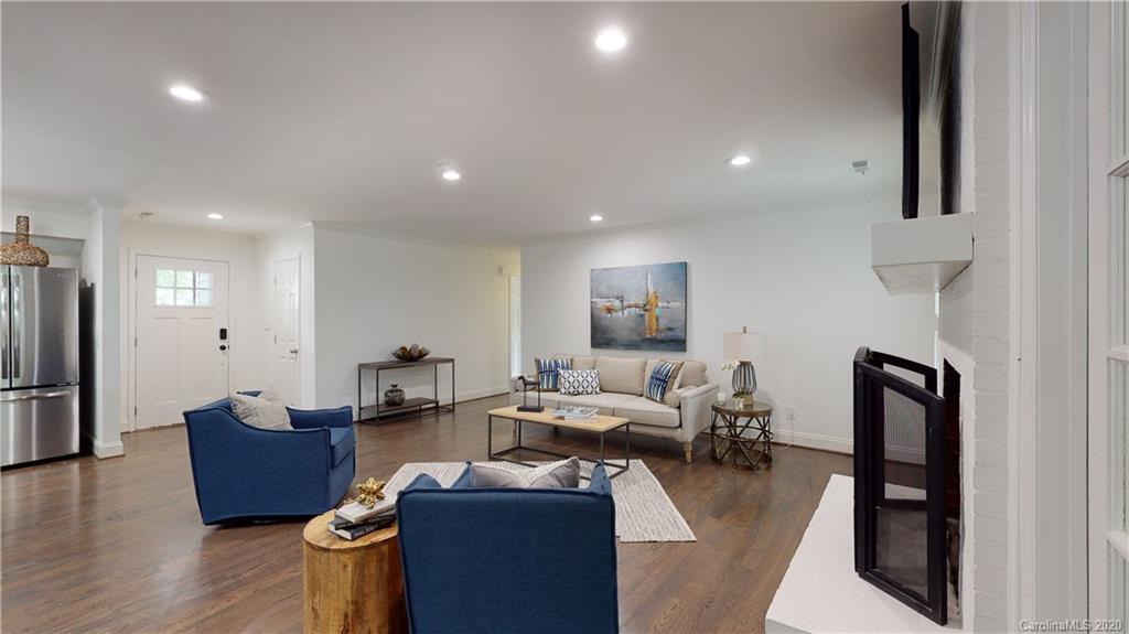 244 Scofield Road Charlotte, NC 28209 - Photo 12 of 30 a living room with furniture a large window and wooden floor