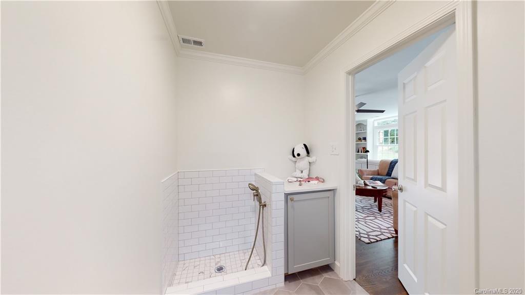 244 Scofield Road Charlotte, NC 28209 - Photo 17 of 30 a bathroom with a sink and mirror