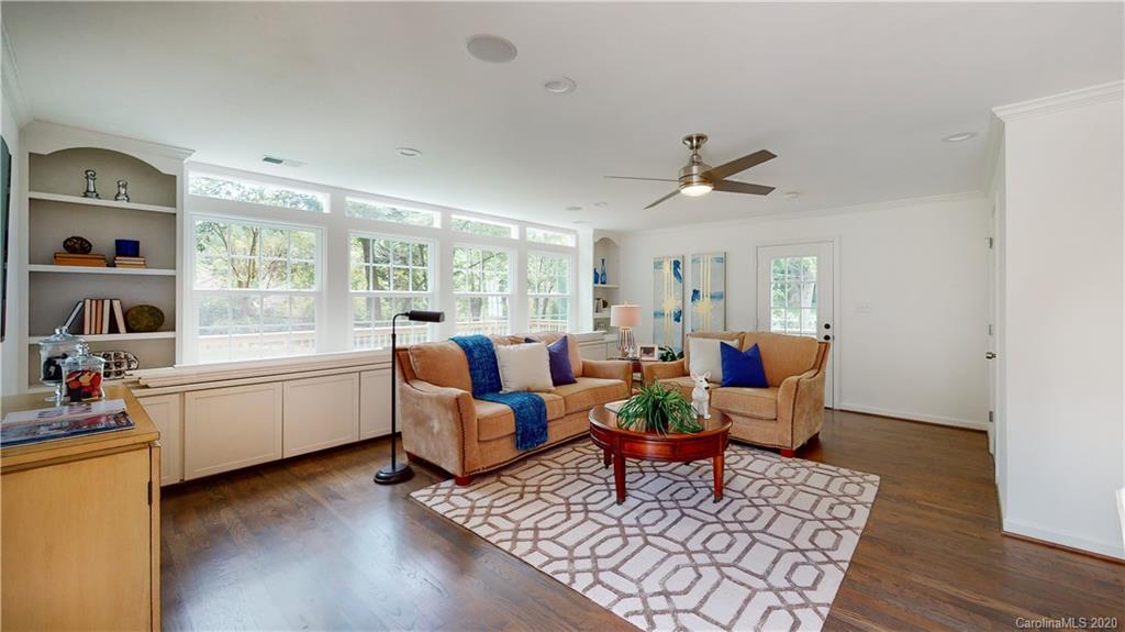244 Scofield Road Charlotte, NC 28209 - Photo 23 of 30 a living room with furniture and wooden floor