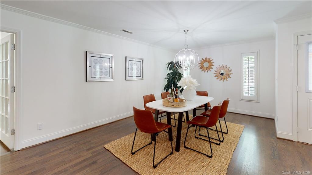244 Scofield Road Charlotte, NC 28209 - Photo 24 of 30 a view of a dining room with furniture window and wooden floor