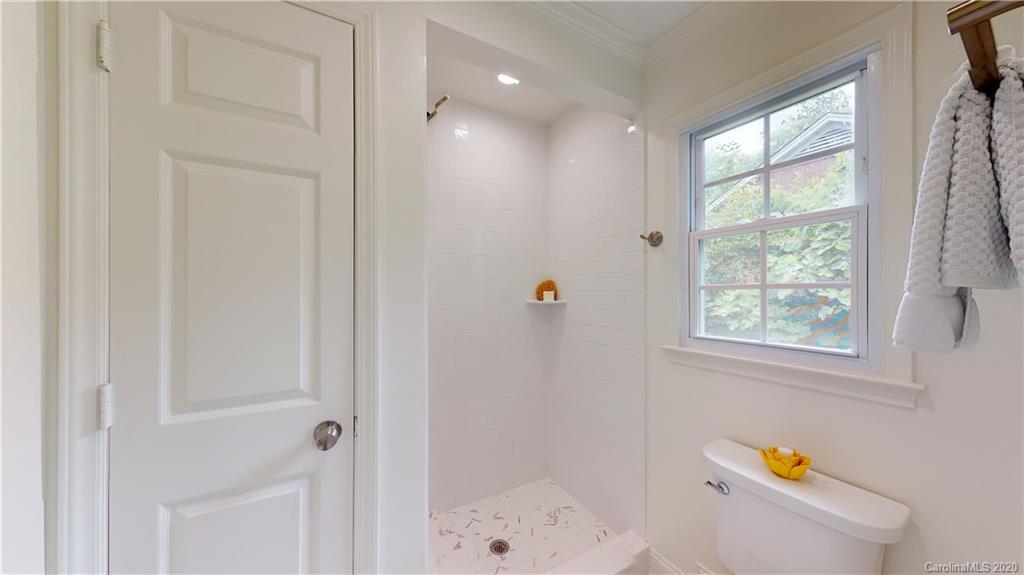 244 Scofield Road Charlotte, NC 28209 - Photo 26 of 30 a bathroom with a bathtub and shower