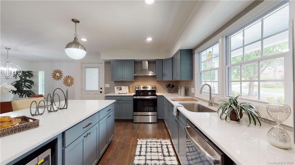 244 Scofield Road Charlotte, NC 28209 - Photo 5 of 30 a kitchen with a sink stove and cabinets