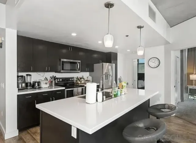 a dining room with furniture and wooden floor