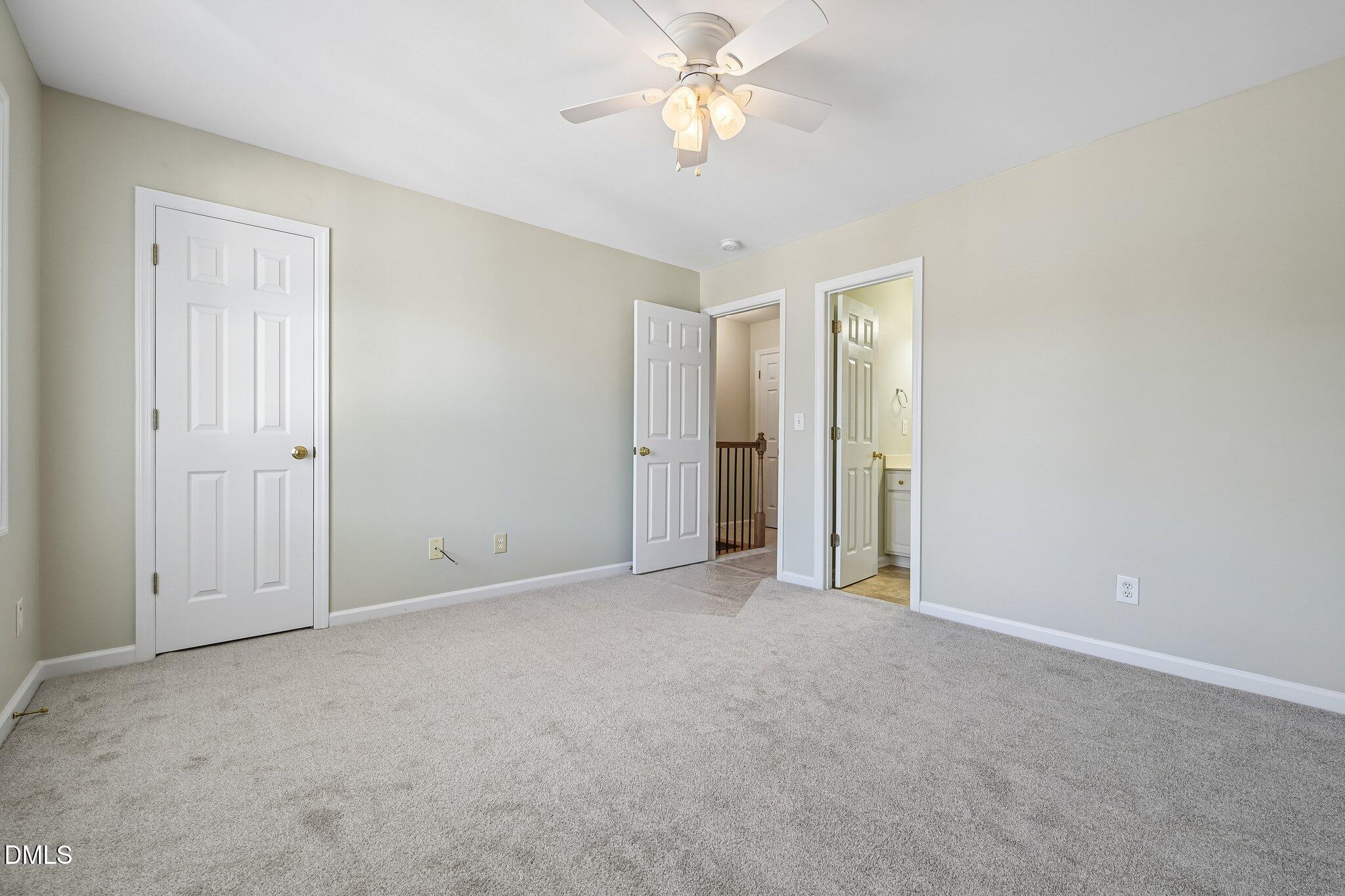 278 South Raleigh Street Angier, NC 27501 - Photo 20 of 35 an empty room with closet and a ceiling fan