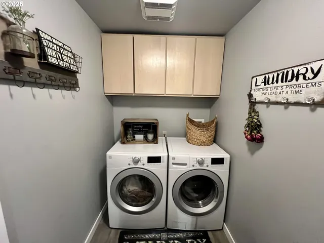 a utility room with sink dryer and washer