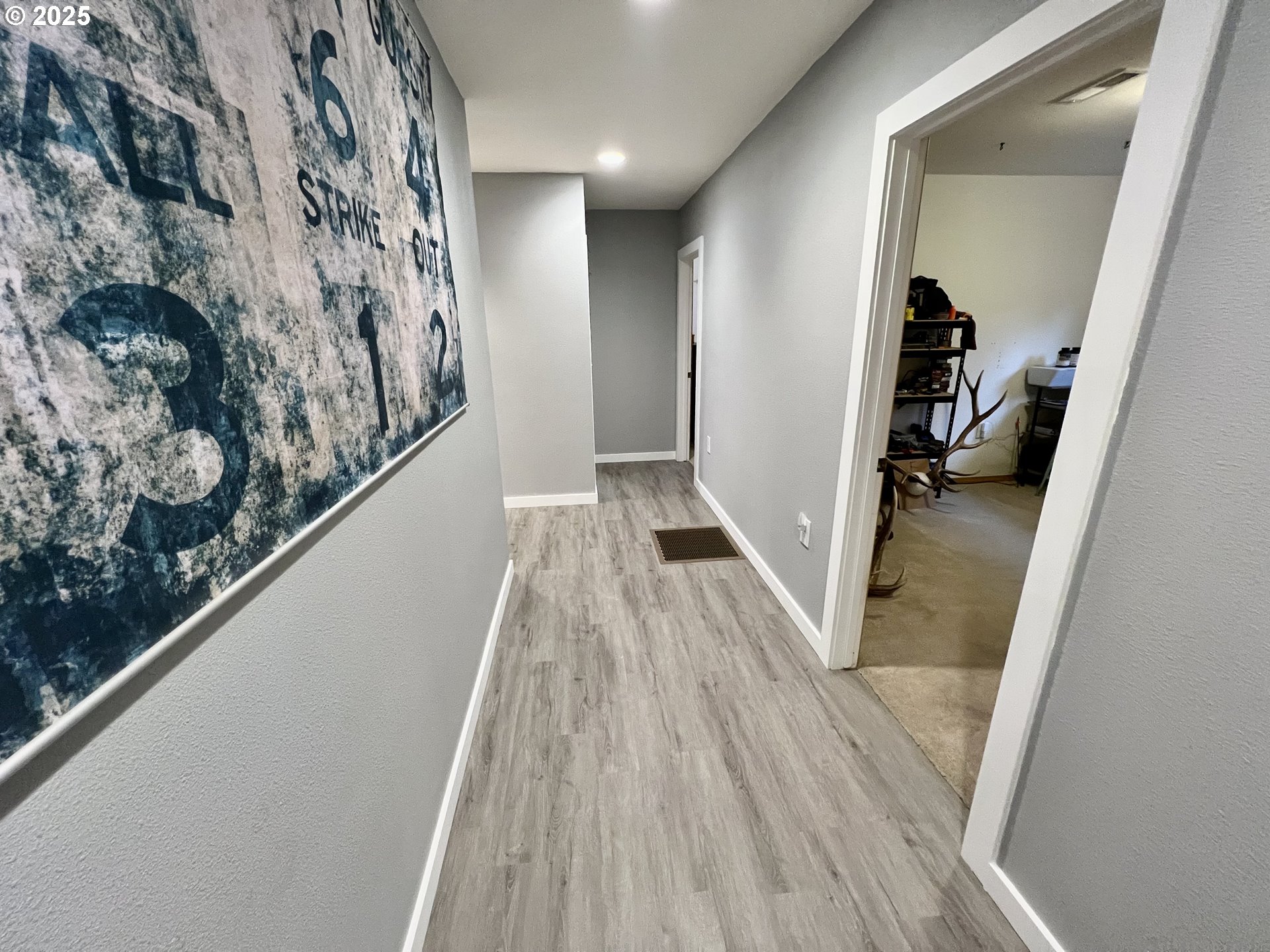 707 Highland Drive La Grande, OR 97850 - Photo 17 of 28 a view of hallway with wooden floor