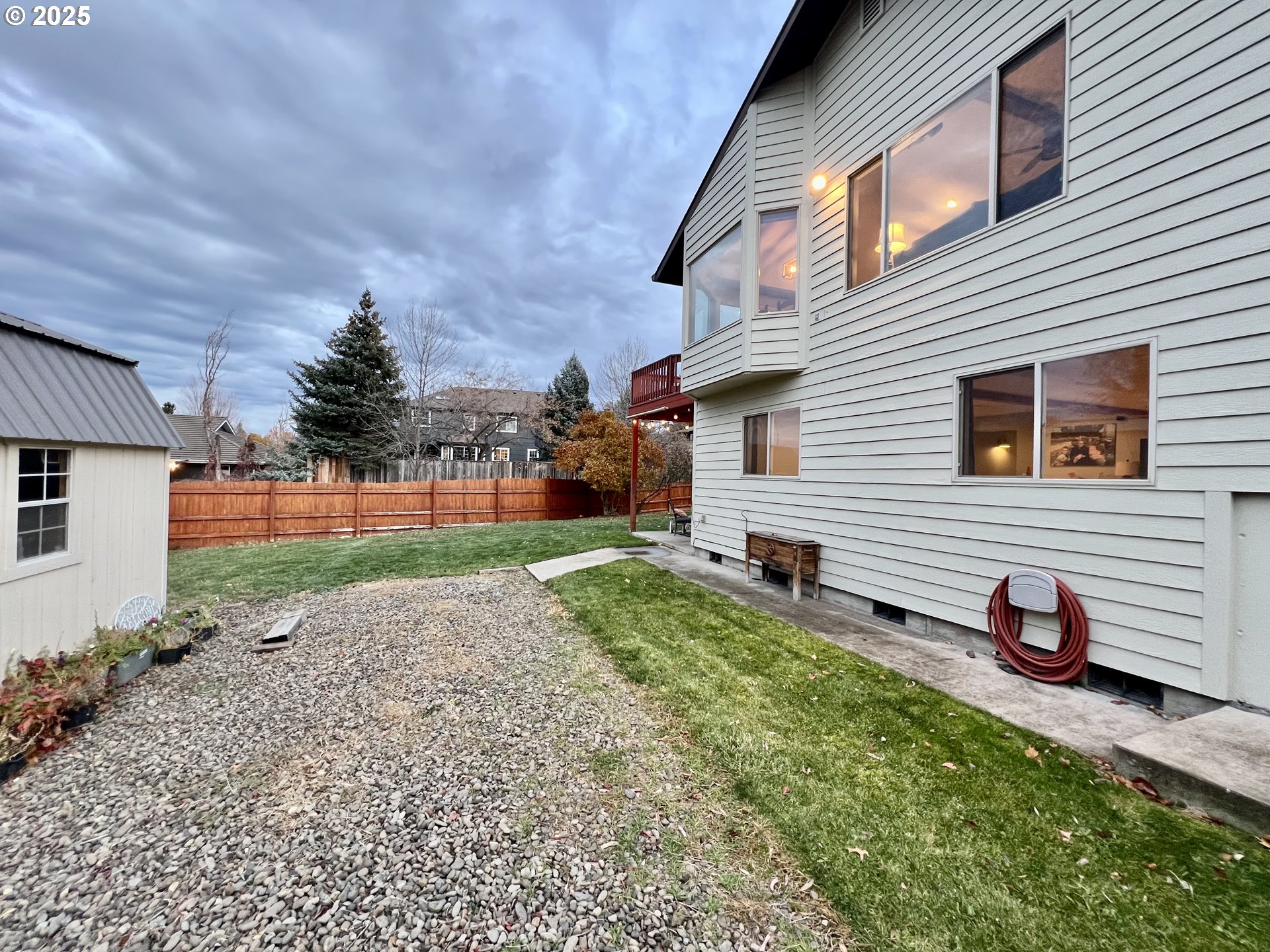 707 Highland Drive La Grande, OR 97850 - Photo 26 of 28 a view of a house with backyard and a tree