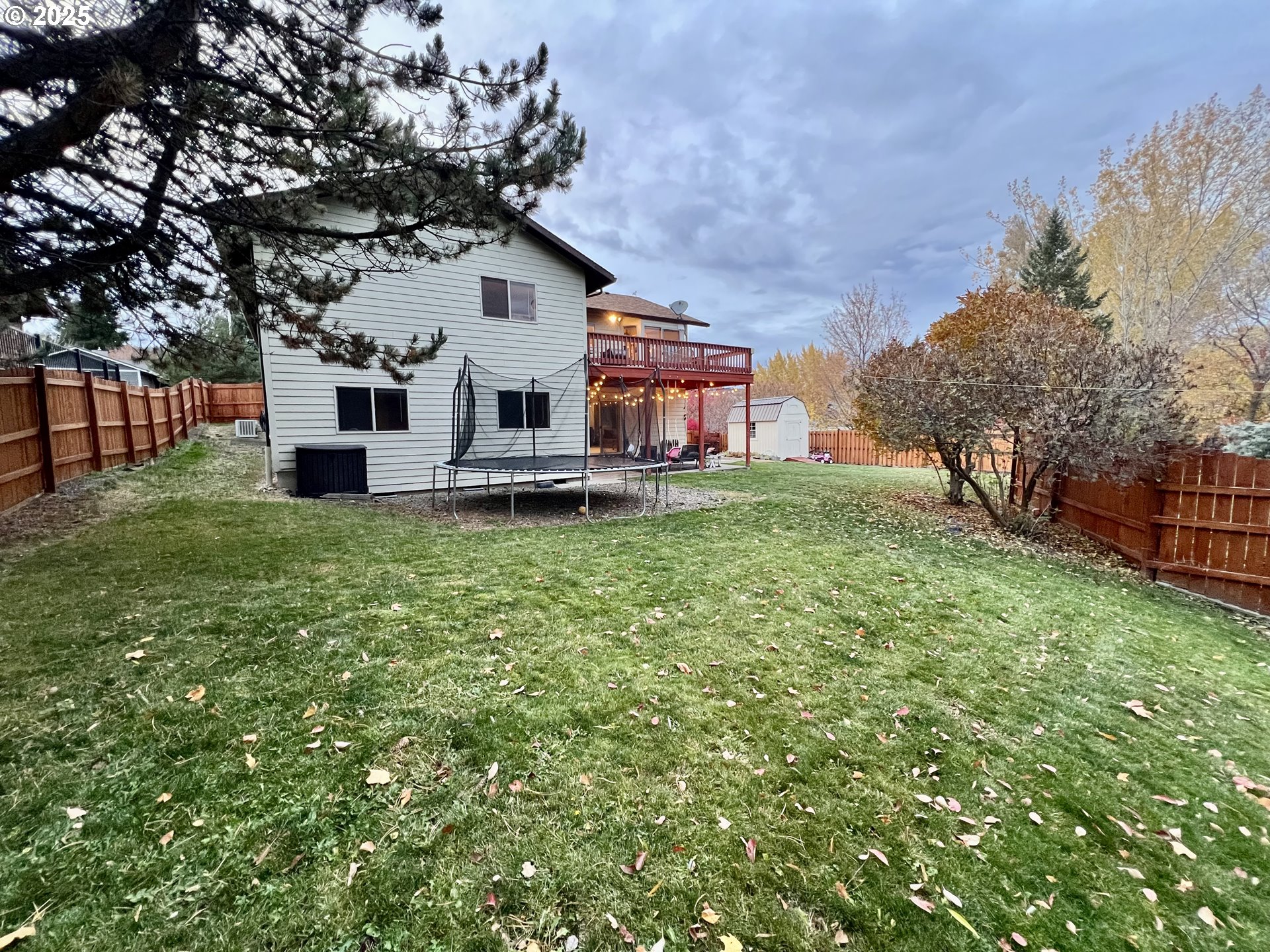 707 Highland Drive La Grande, OR 97850 - Photo 27 of 28 a house that has a tree in front of it