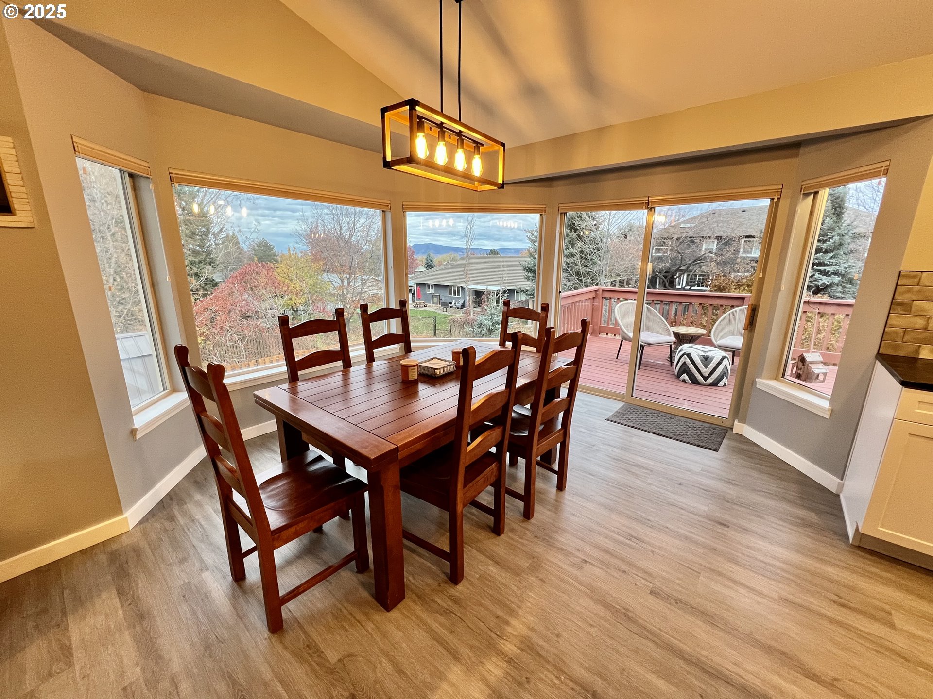 707 Highland Drive La Grande, OR 97850 - Photo 7 of 28 a view of a dining room with furniture large window and wooden floor