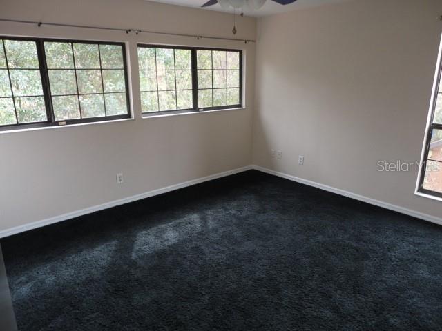 5841 Southwest 8th Place Gainesville, FL 32607 - Photo 11 of 15 an empty room with a window
