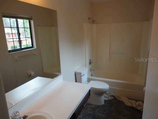 5841 Southwest 8th Place Gainesville, FL 32607 - Photo 14 of 15 a bathroom with a toilet and a shower