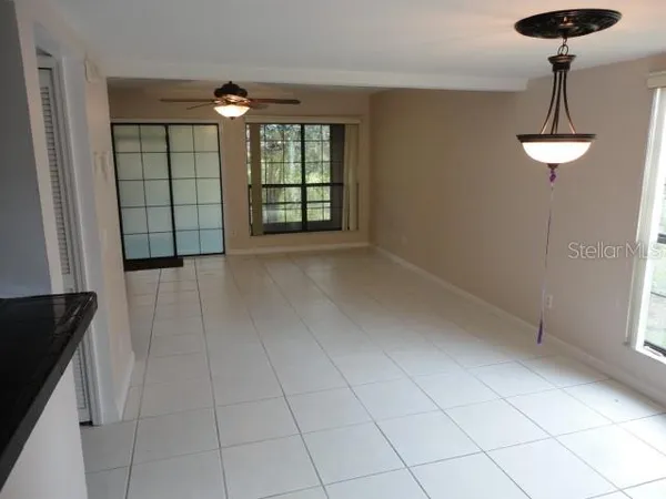 a view of an empty room with a window