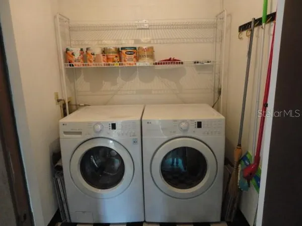 a utility room with dryer and washer