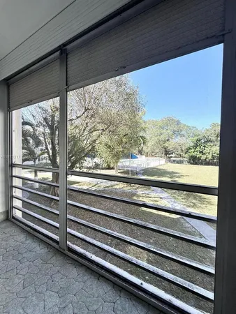 a view of side room with wooden floor and windows