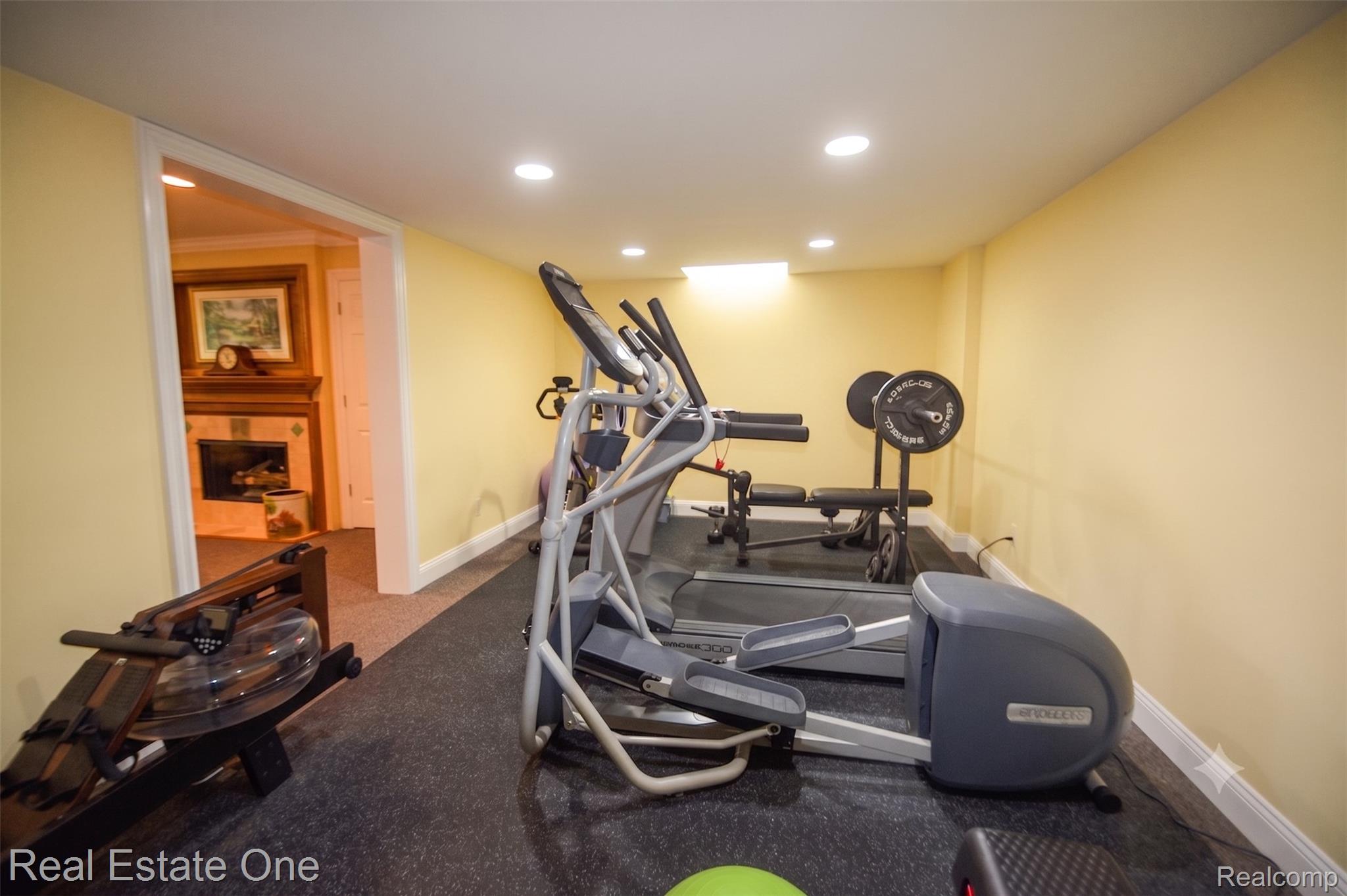 1793 Skyline Drive Rochester, MI 48306 - Photo 29 of 38 Dedicated exercise space featuring recessed lighting, light-colored walls, white baseboards, and specialized rubber flooring