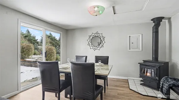 a view of a dining room with furniture window and wooden floor