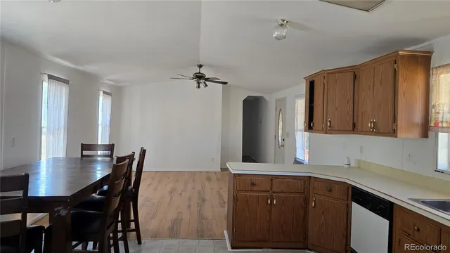 a kitchen with a table and chairs in it