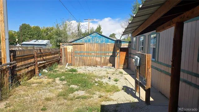a house view with a backyard space