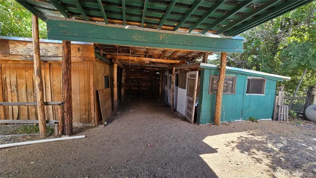 a view of a room with wooden walls