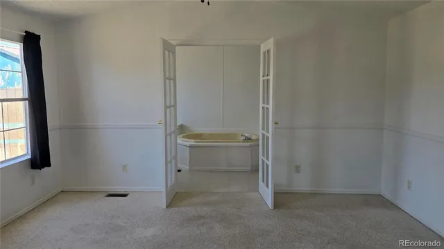 an empty room with a door