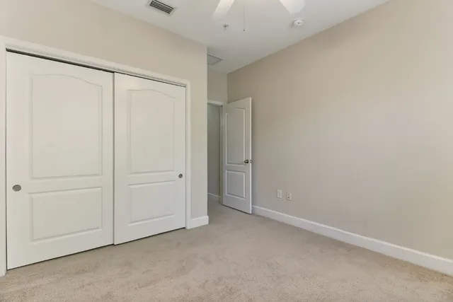 a bathroom with a sink toilet vanity and tub