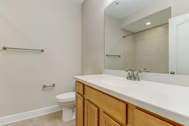 an empty room with a ceiling fan and a window