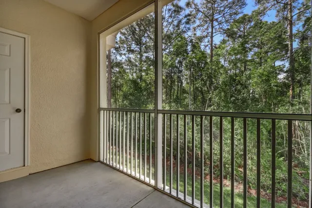 a view of a house with yard and porch