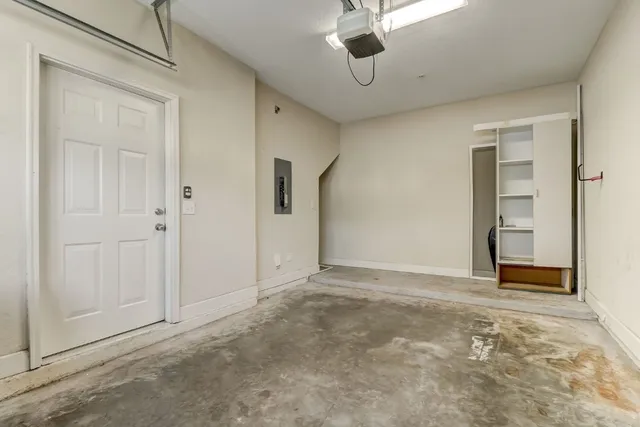 a row of palm trees and dinning table and chairs in the patio