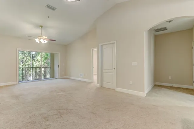 a kitchen with a refrigerator a stove top oven and kitchen island