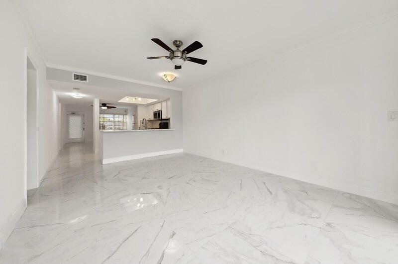 9500 Southwest 3rd Street, Unit 103 Boca Raton, FL 33428 - Photo 6 of 15 07_9500SW3rdSt_Unit103_91_KitchenLivingR