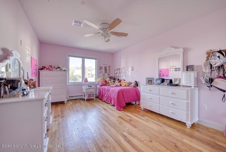 47 Brookside Loop Staten Island, NY 10309 - Photo 12 of 26 a bed room with a bed and a window