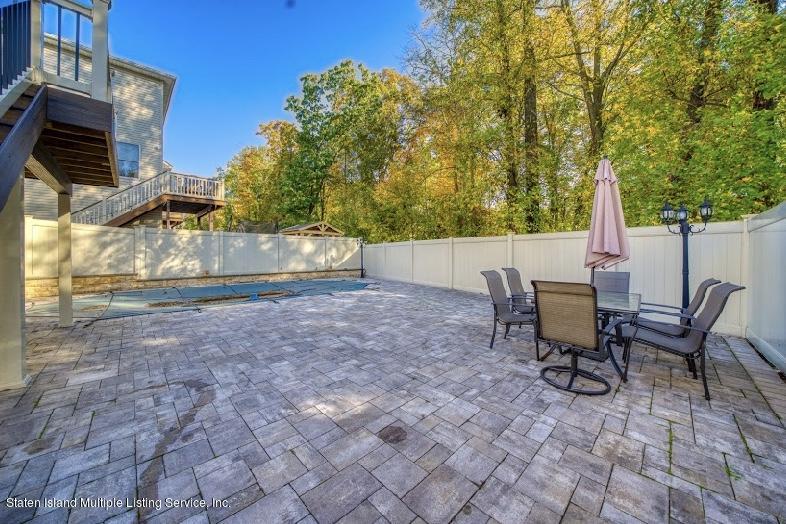 47 Brookside Loop Staten Island, NY 10309 - Photo 25 of 26 a view of backyard with outdoor seating