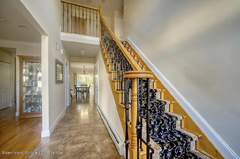 47 Brookside Loop Staten Island, NY 10309 - Photo 3 of 26 a view of an entryway with wooden floor