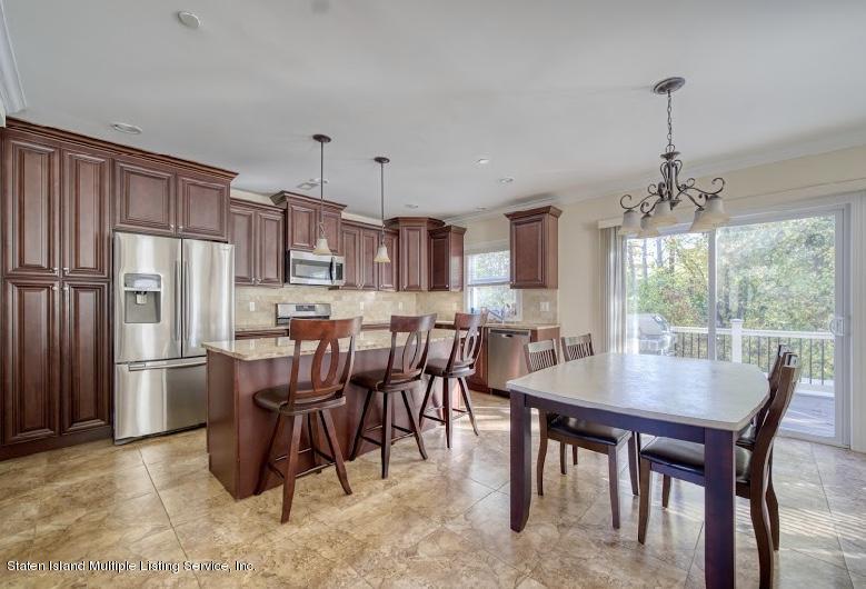 47 Brookside Loop Staten Island, NY 10309 - Photo 6 of 26 a view of a dining room with furniture window and outside view