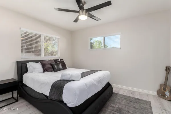 a bed room with a bed and a window
