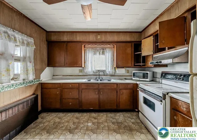 a view of a bathroom with a sink and mirror