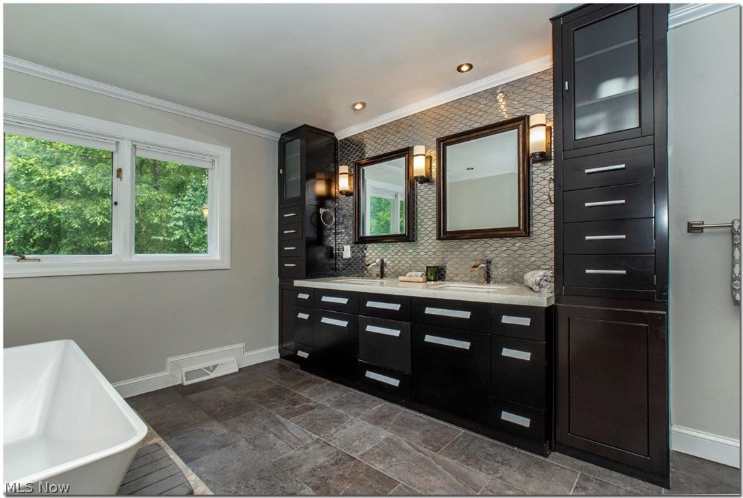 3200 Lander Road Pepper Pike, OH 44124 - Photo 21 of 35 French doors lead to the Owner’s Suite with walk-in closet and the lavish master bath features dual vanities, a soaking tub, and spacious glass shower