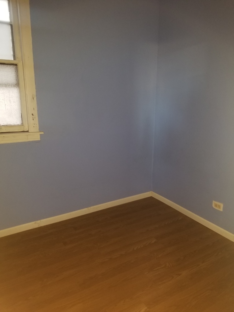 2453 West 46th Place, Unit 1 Chicago, IL 60632 - Photo 13 of 13 a view of an empty room with a window