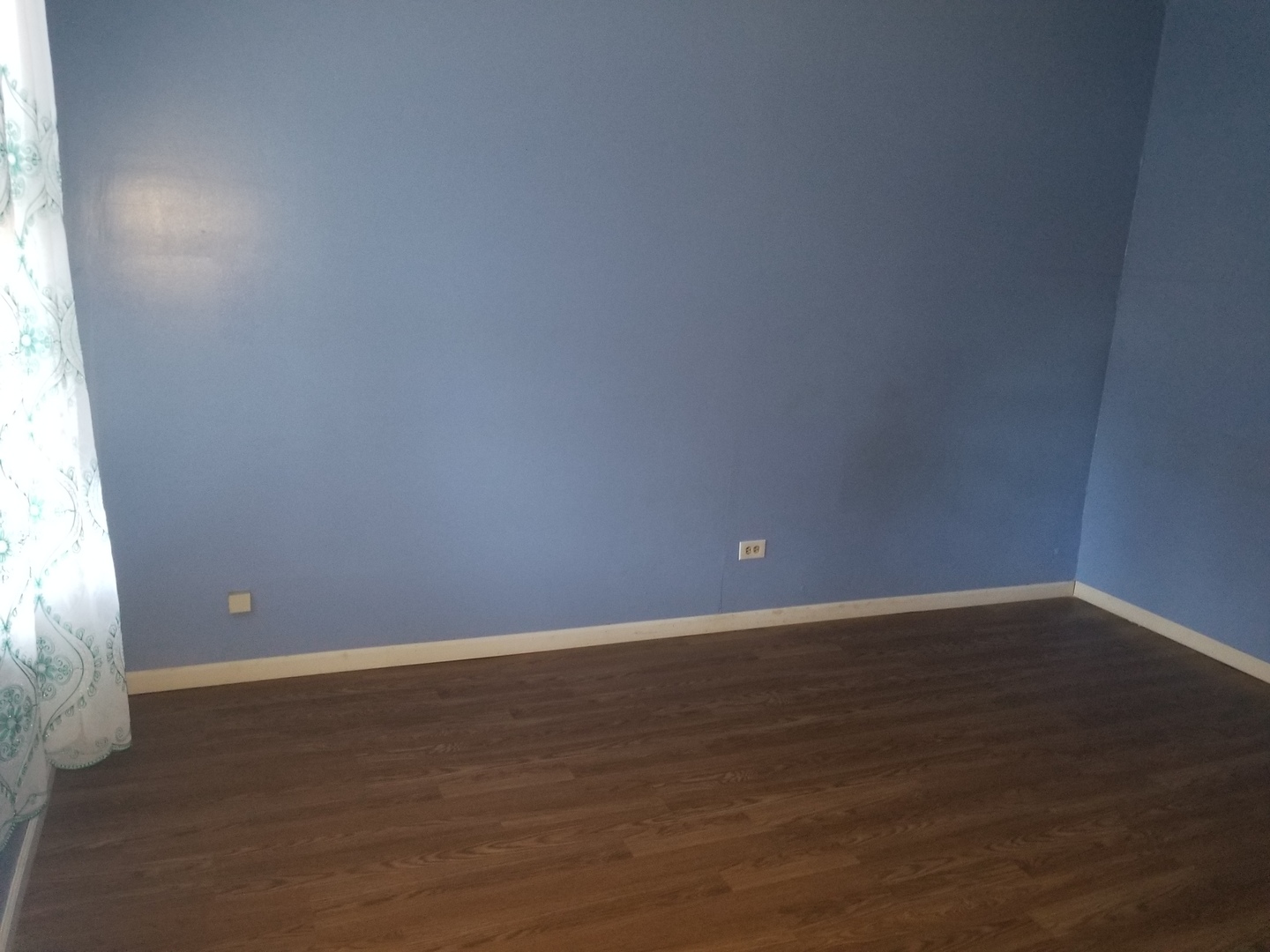 2453 West 46th Place, Unit 1 Chicago, IL 60632 - Photo 4 of 13 a view of an empty room with wooden floor and a window