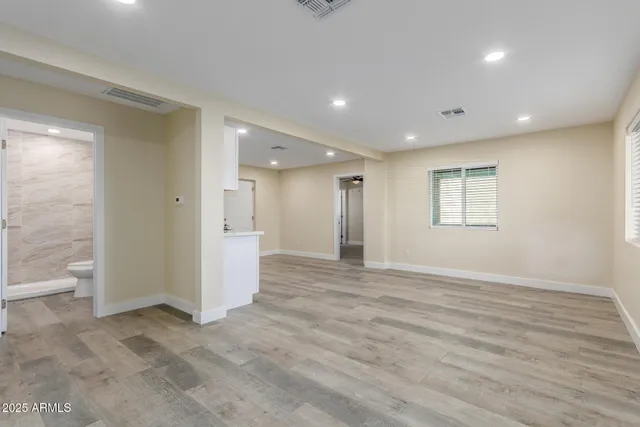 a view of an empty room with a window