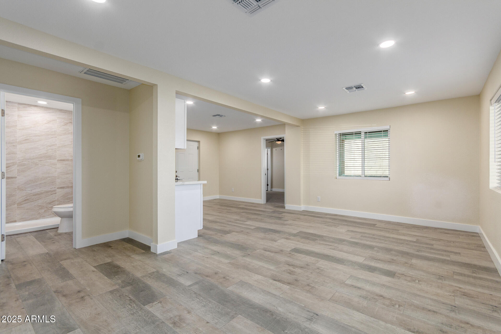 2749 West Montecito Avenue Phoenix, AZ 85017 - Photo 4 of 20 a view of an empty room with a window