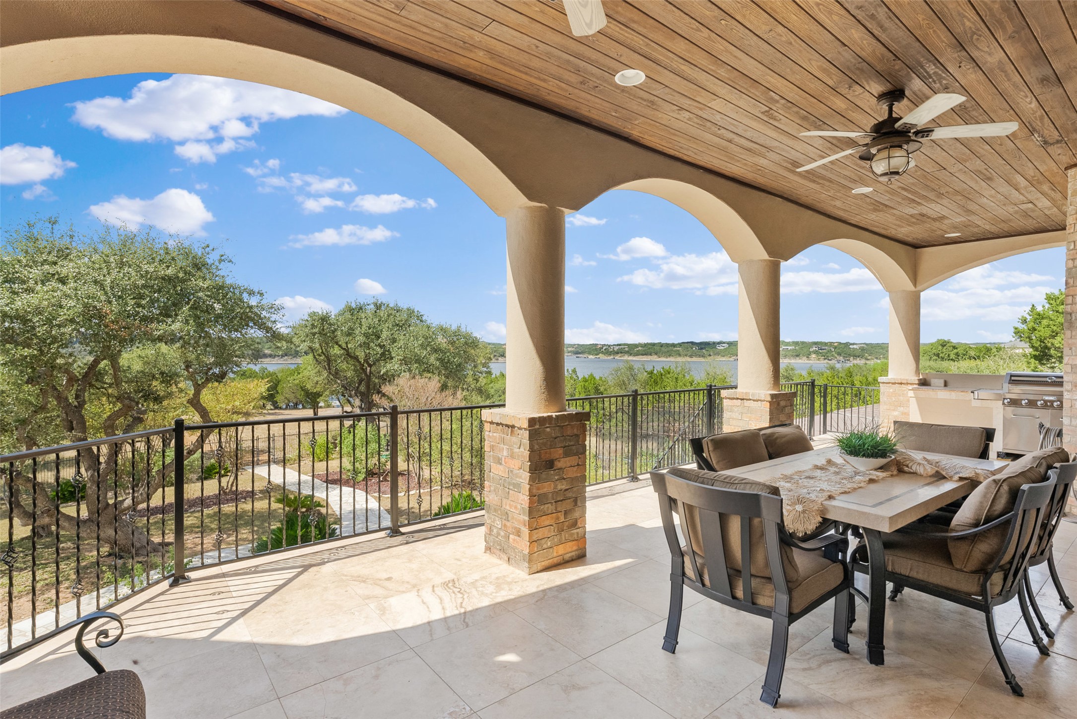 316 Lakefront Drive Point Venture, TX 78645 - Photo 15 of 40 a view of a patio with a table chairs and backyard