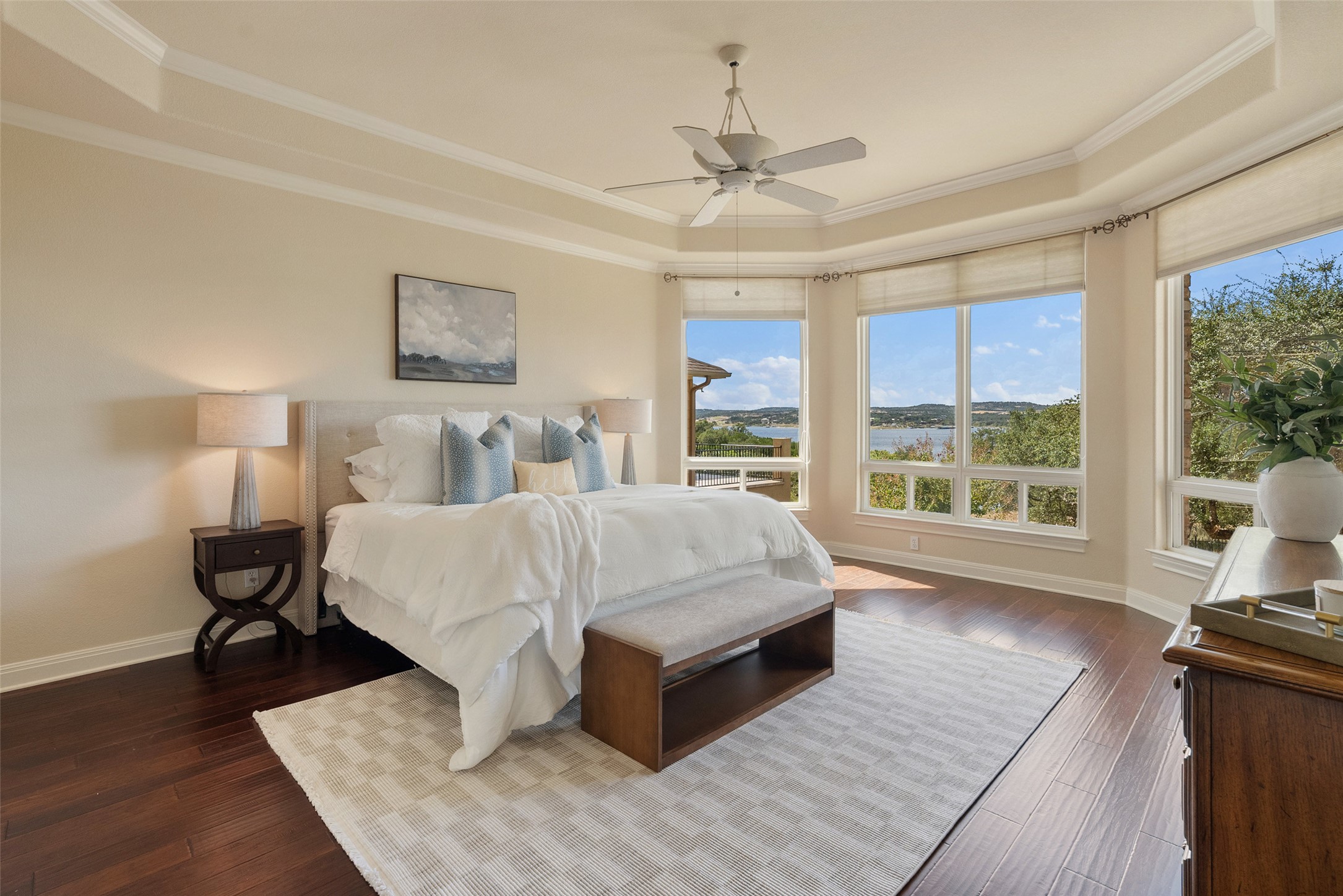 316 Lakefront Drive Point Venture, TX 78645 - Photo 16 of 40 a spacious bedroom with a bed and wooden floor