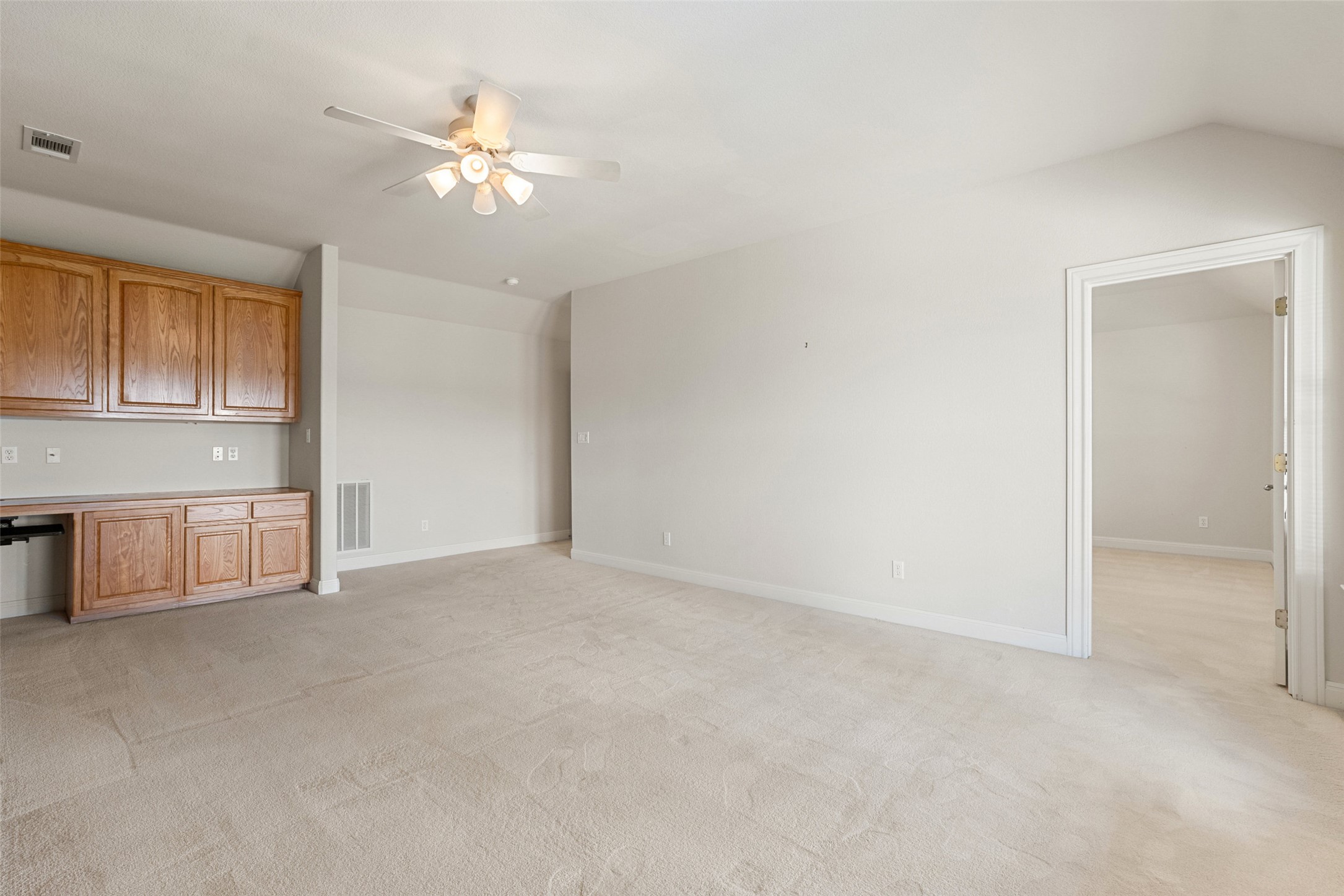 316 Lakefront Drive Point Venture, TX 78645 - Photo 21 of 40 a view of an empty room with a ceiling fan