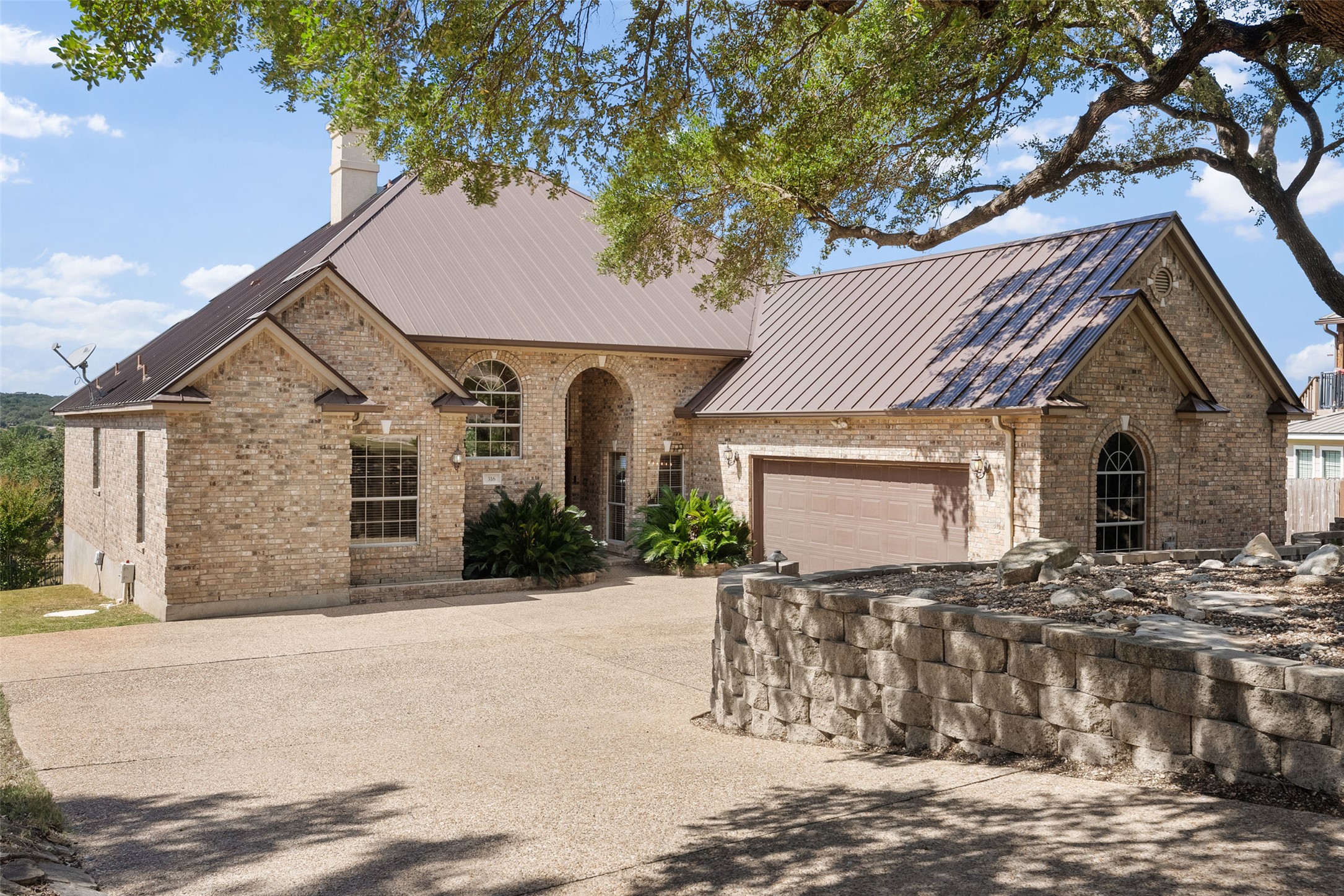 316 Lakefront Drive Point Venture, TX 78645 - Photo 27 of 40 a front view of a house with a yard
