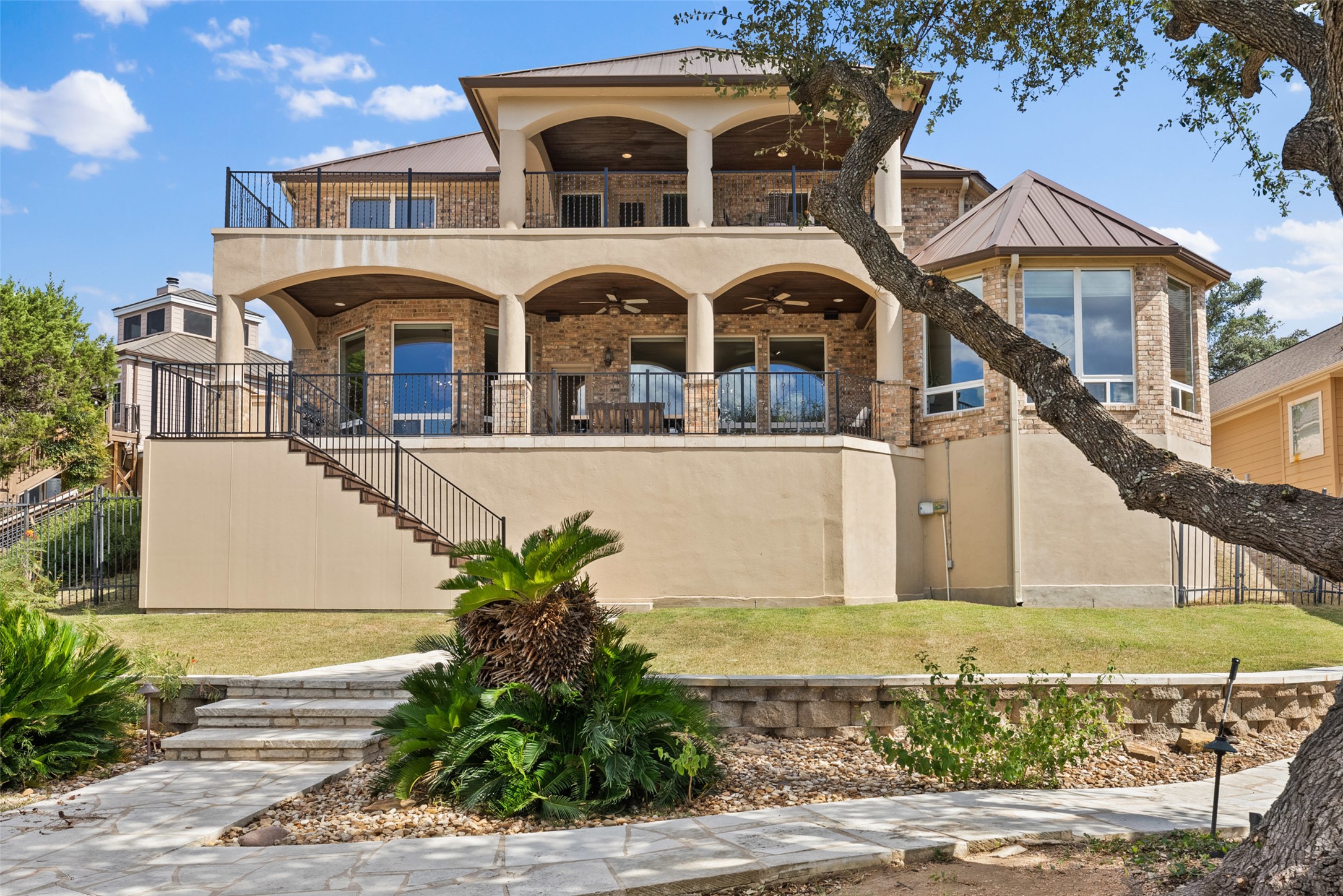 316 Lakefront Drive Point Venture, TX 78645 - Photo 30 of 40 a front view of a house with a yard