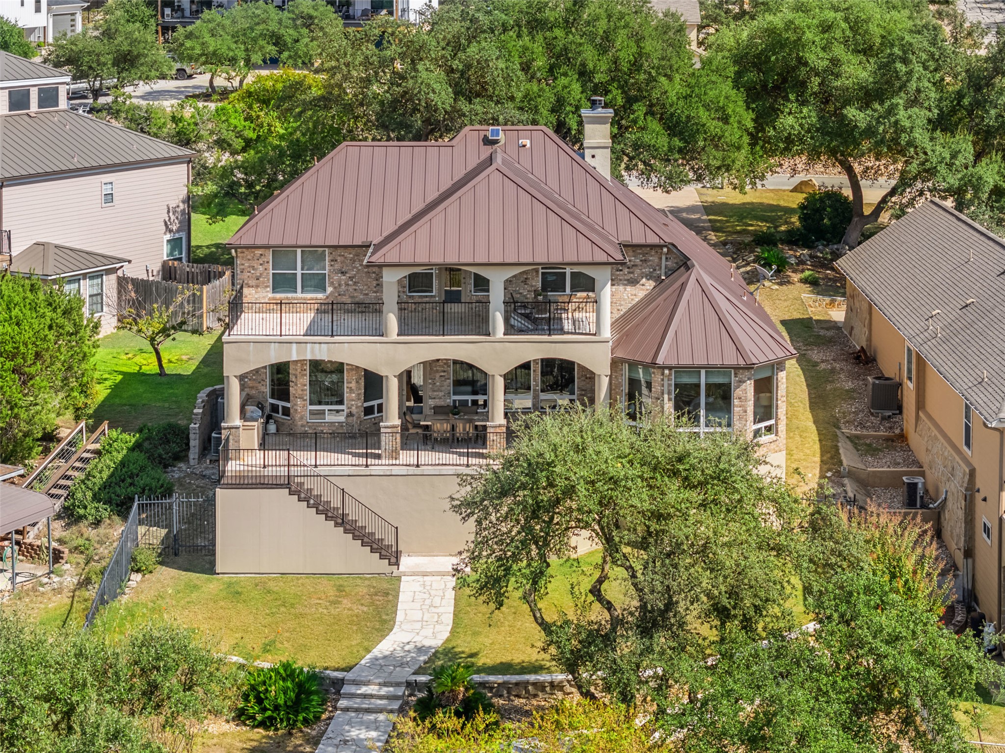 316 Lakefront Drive Point Venture, TX 78645 - Photo 6 of 40 a front view of a house with yard and green space
